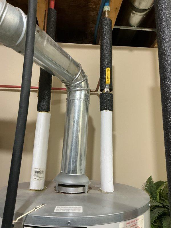 Responded to no hot water complaint on 14-year-old residential water heater. Upon inspection, determined unit had reached end of serviceable life and recommended replacement. Customer approved installation of new water heater. Removed old unit, installed new residential water heater with proper venting and plumbing connections including copper supply lines, pressure relief valve, and code-compliant piping configuration. Tested all connections for leaks, verified proper operation, and confirmed hot water delivery to fixtures throughout home.