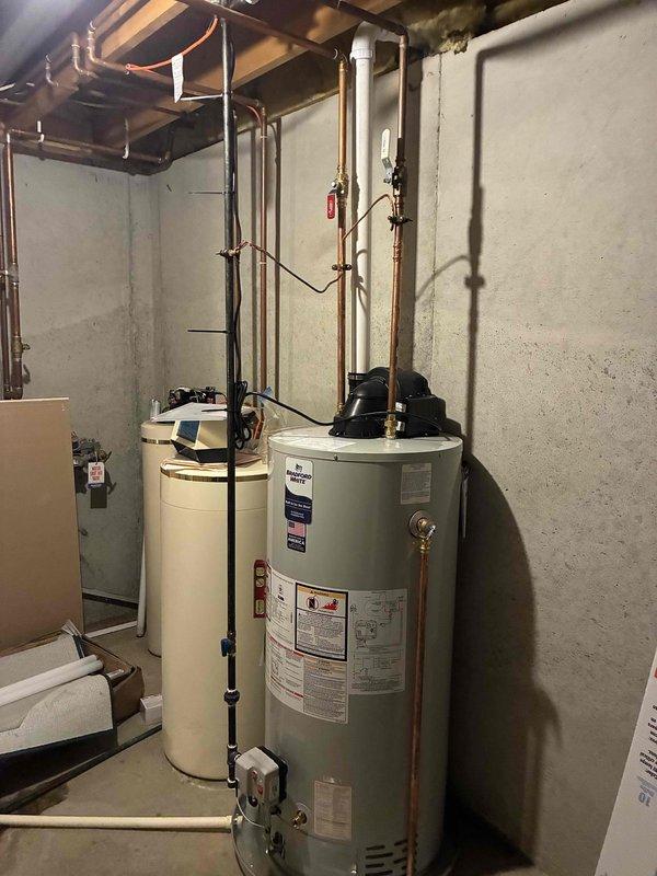 Successfully completed full replacement of residential air conditioning system and water heater unit. Removed existing equipment and installed new water heater with proper copper piping connections, pressure relief valve, and expansion tank in basement utility area. Connected all plumbing lines to manufacturer specifications and verified proper water flow. Installed replacement AC system with refrigerant lines and electrical connections. Tested both systems for proper operation, checked all safety devices, and confirmed no leaks in water or refrigerant lines. All installations meet code requirements and equipment is functioning within normal parameters.