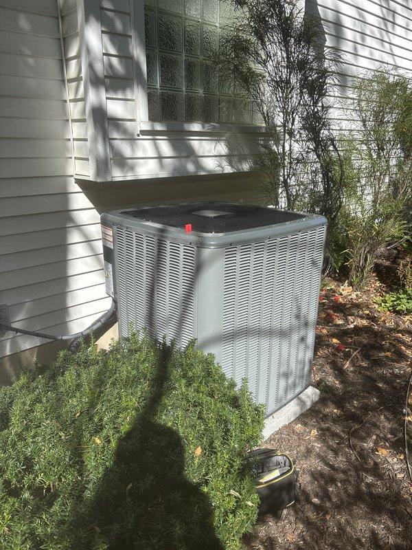 Completed full HVAC system installation including new furnace and air conditioning condenser unit. Installed furnace in basement mechanical room with proper clearances and ventilation requirements, connected silver ductwork to existing distribution system, and integrated with PVC drainage piping. Mounted outdoor AC condenser unit on concrete pad against exterior wall with protective top grille, verified proper refrigerant line connections between indoor and outdoor components. All equipment labeled with manufacturer specifications, system tested for proper operation, and installation meets code requirements for residential heating and cooling applications.