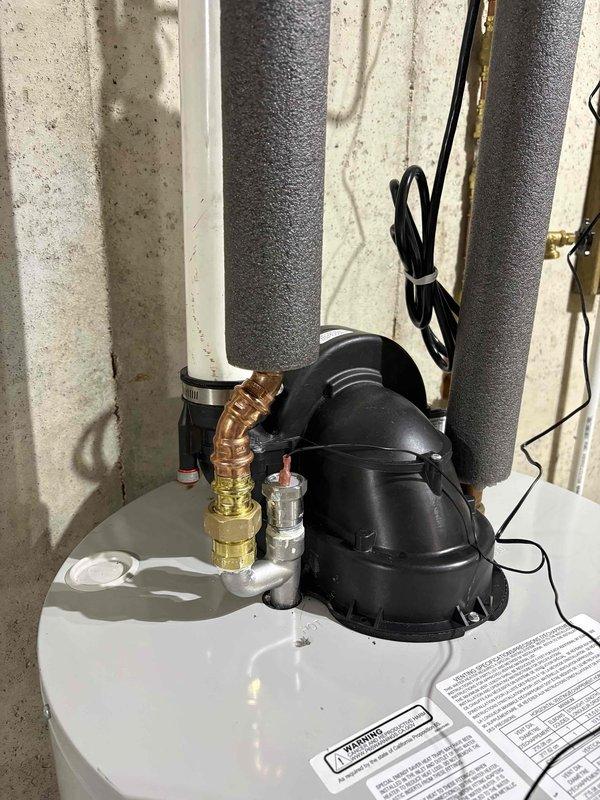 Completed installation of electric anode rod on Bradford White water heater as quoted repair with partial warranty coverage. Unit inspected, existing anode rod removed, and new electric anode rod installed with proper electrical connections verified and secured. All plumbing connections, pressure relief valve, and top assembly components checked for proper operation following installation.