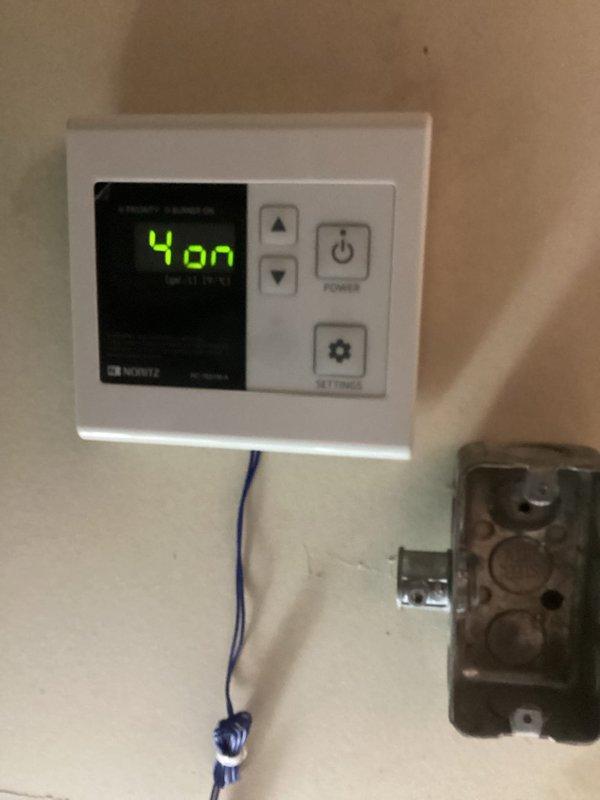 Responded to service call for dual Noritz tankless water heater system with reported slow hot water delivery. Performed diagnostic inspection of both units, accessing internal components to assess heat exchanger condition, control boards, and plumbing configuration. Evaluated digital controller display showing operational status and reviewed system settings. Inspected copper supply and return piping, connection points, and isolation valves for proper installation and flow restrictions. Photographed equipment configuration and internal components for documentation. Provided customer with diagnostic findings and quoted necessary repairs to restore optimal hot water delivery performance.