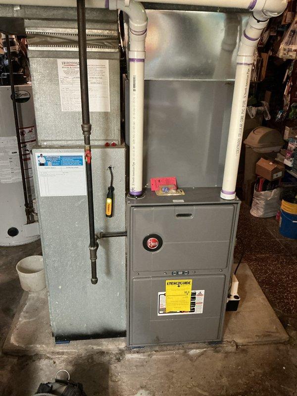 Completed annual heating maintenance on 12-year-old Rheem furnace system. Performed comprehensive tune-up including inspection of heat exchanger, burner assembly, and gas valve operation. Cleaned and tested ignition system, verified proper flame sensor operation, and checked all electrical connections. Inspected and tested blower motor and capacitor for proper operation. Verified refrigerant line connections and service ports at air handler unit. Checked condensate drain system including PVC drain lines for proper flow and cleared any restrictions. Tested all safety controls including limit switches and pressure switches to ensure proper functionality. Measured temperature rise across heat exchanger and confirmed within manufacturer specifications. Replaced air filter and verified proper airflow throughout system. Inspected ductwork connections for air leaks. System operating efficiently with no deficiencies noted. No humidifier present on system as indicated in service notes.