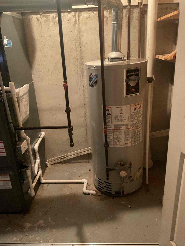 Conducted water heater replacement estimate for residential property with existing conventional tank-style water heater located in basement utility room. Evaluated current installation including venting configuration, gas line connections, and plumbing infrastructure. Provided comprehensive estimate options for both tankless water heater system and traditional tank-style replacement units per client request, discussing advantages and considerations of each system type based on household needs and existing mechanical setup.