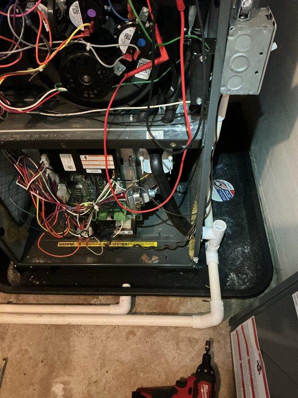 Completed annual heating maintenance on 9-year-old Energi Air Systems Elite Series furnace. Performed comprehensive system inspection including visual examination of all electrical connections, capacitors, and control board components. Verified proper operation of blower motor assembly, checked all wire connections for security and signs of wear, and inspected condensate drainage system with white PVC piping for proper function. All warning labels present and legible. Unit operating within normal parameters with no immediate concerns identified. Documentation photos captured for service records.