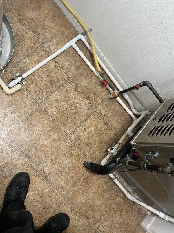 Completed installation of automatic whole-home humidifier system integrated with existing HVAC equipment. Connected water supply line using PVC piping with proper fittings and drainage, installed humidifier unit to furnace cabinet with appropriate mounting hardware, and established electrical connections for automatic operation per customer preference.