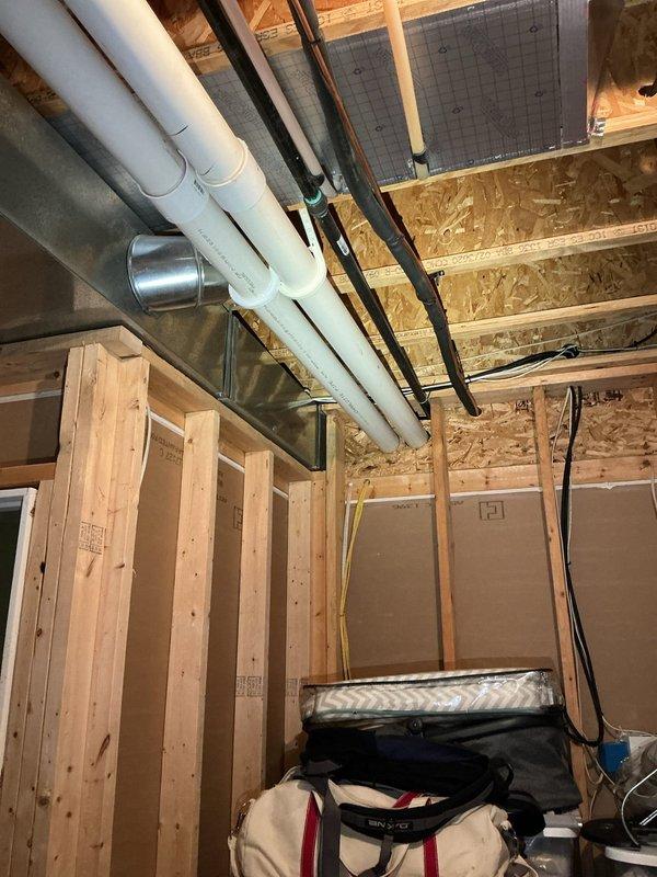 Responded to gas leak call at residential property where customer had shut off gas supply as a safety precaution. Located and identified gas leak originating from piping outside the furnace room in basement area. Inspected exposed gas lines running through unfinished basement space with visible framing and mechanical systems. Assessed leak point on gas piping, performed necessary repairs to eliminate leak, and pressure tested system to verify integrity of repair. Restored gas service and confirmed all connections were secure with no detectable leaks present upon completion.
