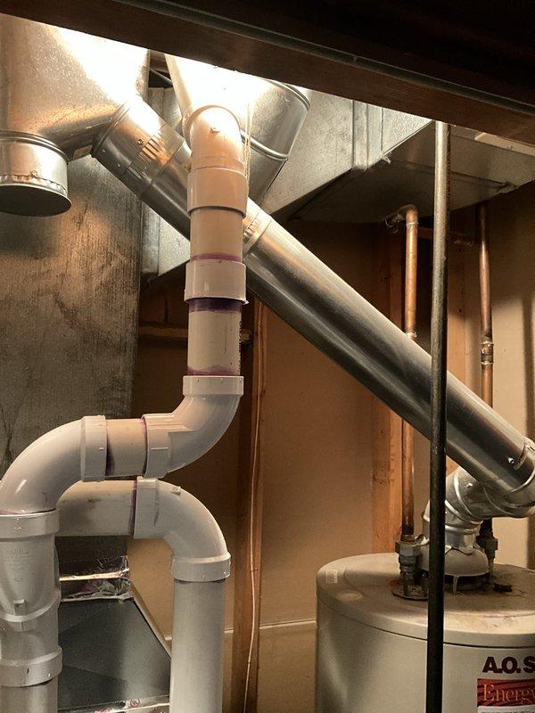Completed free estimate for water heater replacement at residential property. Assessed existing 15-year-old tank-style water heater located in basement utility area alongside Carrier furnace system. Documented current installation configuration including copper supply piping, PVC venting arrangement, and proximity to existing HVAC equipment. Photographed equipment specifications, manufacturer labels, clearance requirements, and surrounding infrastructure to prepare replacement recommendations and accurate proposal for customer.