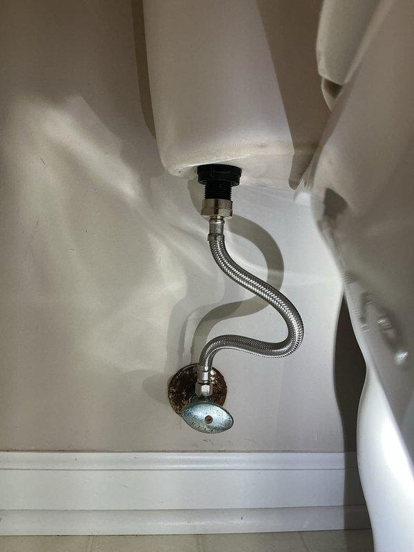 Replaced toilet flush valve and fill valve assembly due to malfunction. During inspection, discovered the water inlet supply line to the toilet tank was damaged and actively leaking, requiring temporary containment with towels. Replaced the faulty water supply line and shutoff valve connection to eliminate the leak. Inspected and verified proper operation of newly installed flush valve and fill valve assembly to ensure complete system functionality.