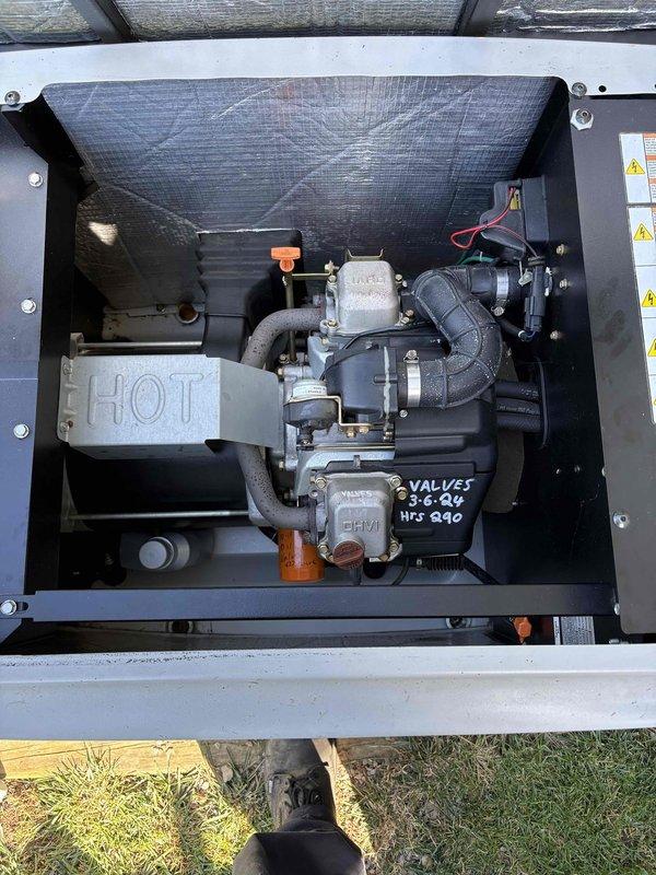 Completed comprehensive tune-up service on 15-year-old Generac generator unit. Performed standard maintenance inspection including examination of engine components, carburetor assembly, fuel system connections, and internal electrical connections. Documented equipment condition with photos showing engine compartment and control panel assembly with valve service notation dated 3-6-06. Unit operational at time of service completion.