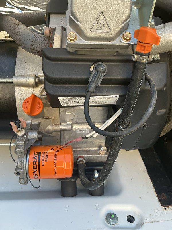 Responded to service call for 4-year-old Generac generator with red warning light illuminated. Upon arrival, performed visual inspection of unit and documented current condition with photographs. Inspected generator components including oil filter assembly, mechanical housing, electrical connections, and associated plumbing connections. Verified Generac genuine parts oil filter was properly installed and secured. Examined all visible wiring harnesses, terminal connections, and protective caps for proper seating and condition. Assessed overall system integrity including mounting hardware, flexible hoses, and rigid piping connections. All components photographed showed normal operational wear with minor dust accumulation typical of outdoor generator installations.
