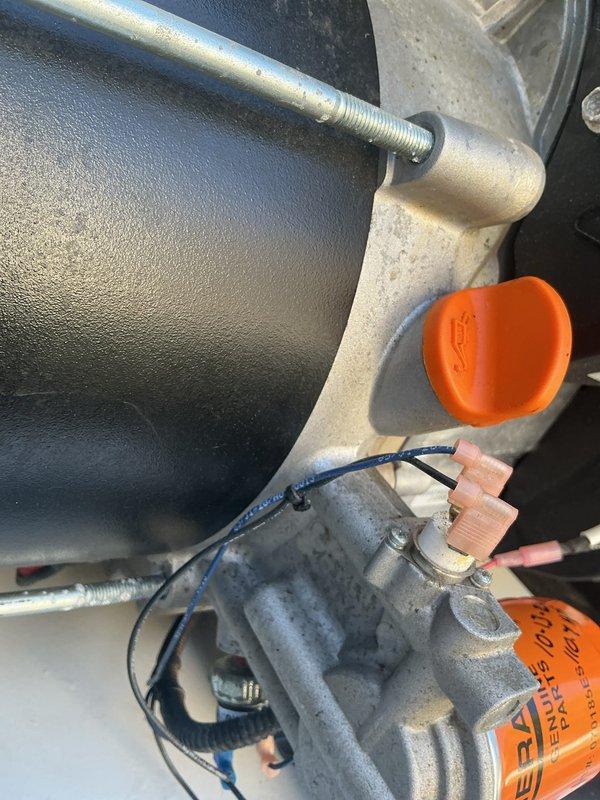 Responded to service call for 4-year-old Generac generator with red warning light illuminated. Upon arrival, performed visual inspection of unit and documented current condition with photographs. Inspected generator components including oil filter assembly, mechanical housing, electrical connections, and associated plumbing connections. Verified Generac genuine parts oil filter was properly installed and secured. Examined all visible wiring harnesses, terminal connections, and protective caps for proper seating and condition. Assessed overall system integrity including mounting hardware, flexible hoses, and rigid piping connections. All components photographed showed normal operational wear with minor dust accumulation typical of outdoor generator installations.