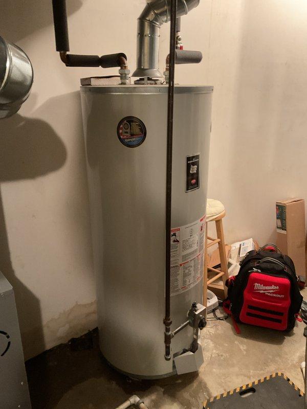 Performed annual heating tune-up on two furnaces (18-year-old and 3-year-old Carrier units) with humidifier service, completing inspection and maintenance on both systems per recurring service schedule. Noted staining on the basement wall near the water heater, suggesting past moisture intrusion, and recommend monitoring the area.