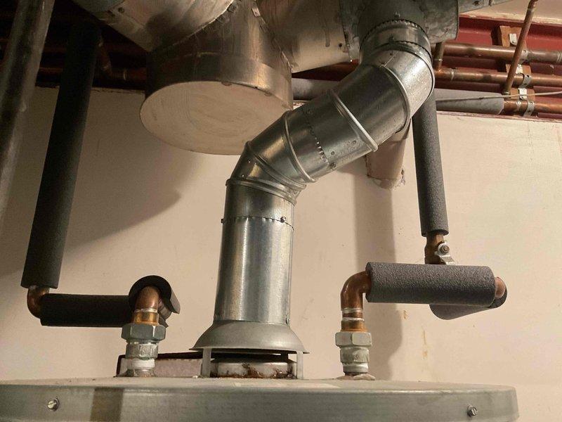 Performed annual heating tune-up on two furnaces (18-year-old and 3-year-old Carrier units) with humidifier service, completing inspection and maintenance on both systems per recurring service schedule. Noted staining on the basement wall near the water heater, suggesting past moisture intrusion, and recommend monitoring the area.