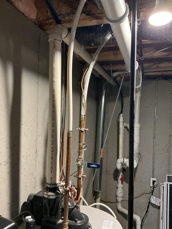 Responded to a reported tank leak on a 14-year-old Bradford White power-vent water heater and inspected the unit, including the blower and vent assembly, PVC exhaust piping, copper supply lines, shutoff valves, and drain piping. The tank and connections showed no visible rust, frost, or active leaking at the time of inspection, and all fittings appeared intact. Same-day emergency service was unavailable, so the customer was placed on the priority schedule for expedited follow-up.