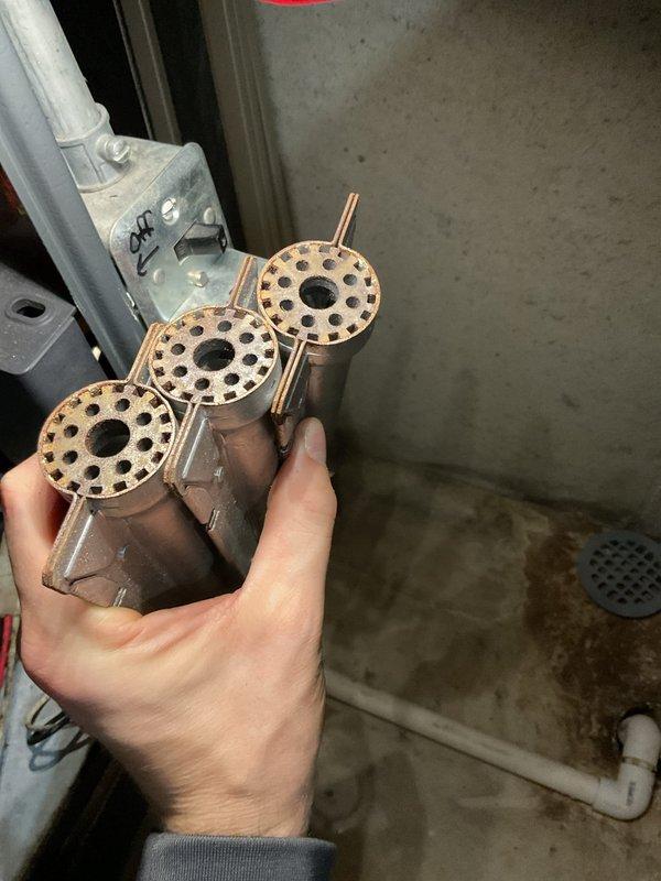 Performed annual heating tune-up on gas furnace with integrated humidifier, including inspection of the burner assembly. Burner tubes were removed and found to have significant rust and heat discoloration on the burner heads, indicating corrosion and age-related wear; recommend monitoring combustion performance and planning for future burner or system replacement. Confirmed customer contact information and noted request to update payment method for assistance at time of service.