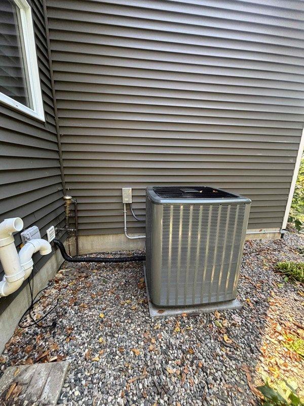 Removed and replaced the existing furnace and air conditioning system, installing a new gas furnace with matched evaporator coil in the basement and a new outdoor condenser on a level concrete pad. Connected refrigerant lines, condensate drain piping, PVC combustion venting, ductwork, and the electrical disconnect, and reconnected the whole-house humidifier. System was verified clean and intact with no visible damage, and financing paperwork was completed and activated.