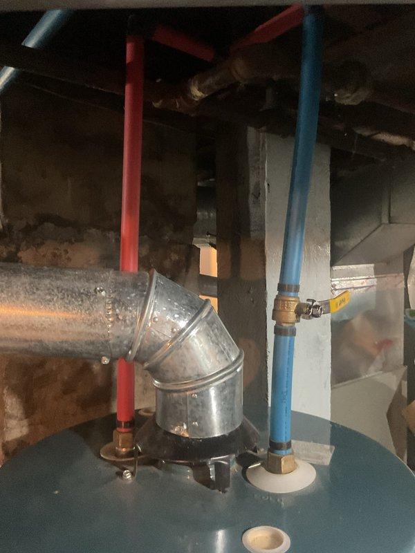 Responded to a Rheem Guardian gas water heater reported as not heating and leaking, and inspected the unit, including the flue connection, inlet and outlet water connections with shutoff valve, and tank fittings. Diagnosed the loss of heating and leak condition and performed the necessary repairs to restore operation. Verified proper venting and connections, confirmed the unit was heating and holding without leaks, and left it operating normally.
