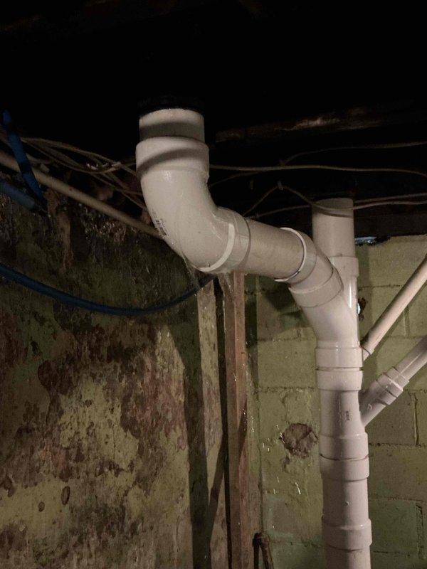 Responded to a washer drain leak and overflow, inspected the PVC drain assembly in the basement, and cleared the blockage in the drain line. Tested the system with water flow and confirmed proper drainage with no leaks or overflow at the standpipe.