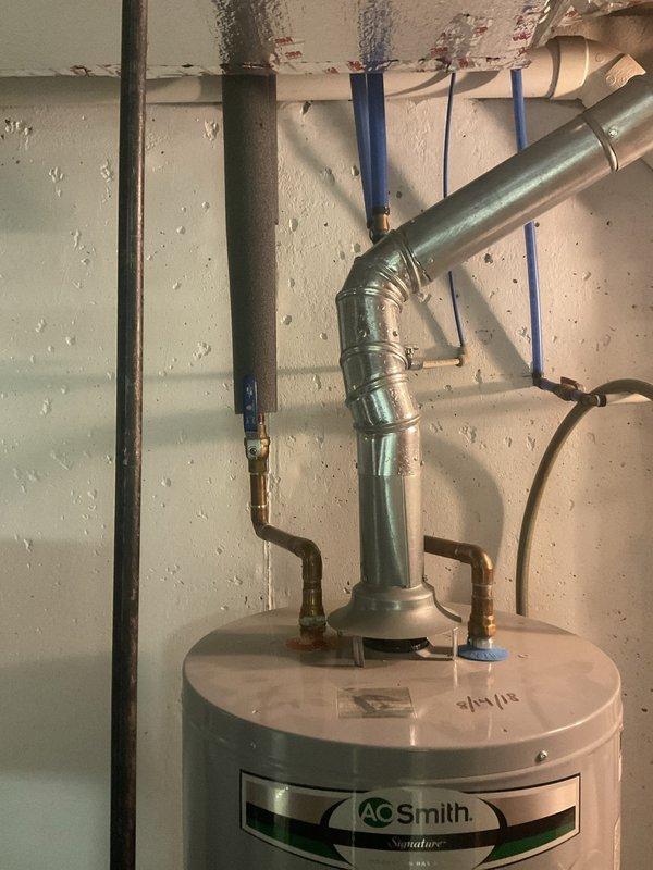 Performed annual maintenance and tune-up on the 19-year-old Lennox furnace, including inspection of heat exchanger, burners, ignition system, flue/venting, and safety controls to verify safe, efficient operation. Visually inspected adjacent gas-fired water heater, galvanized flue connection, and gas line, finding no evidence of leaks, heavy corrosion, or flue deterioration. No humidifier is installed on the system, and equipment was left operating normally at completion.