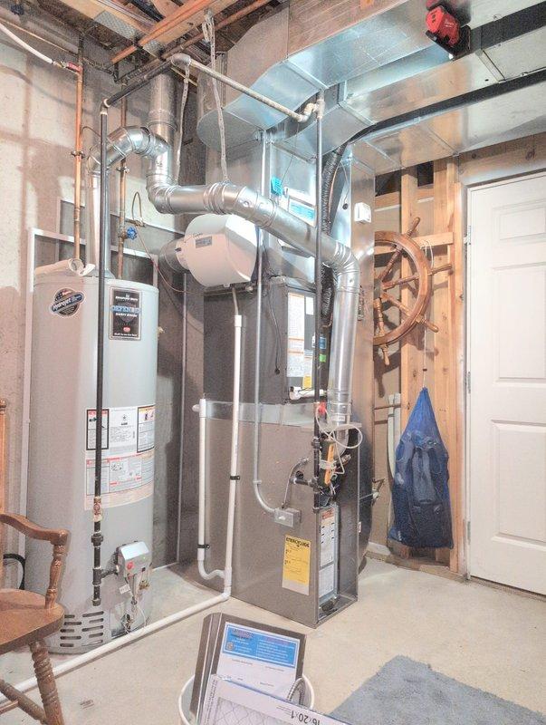 Installed a new gas furnace in the basement mechanical area, connecting it to the existing supply and return ductwork, humidifier, gas supply, and venting. Completed electrical and control connections, mounted the thermostat, and installed a new air filter. Verified proper system operation and left the work area clean.