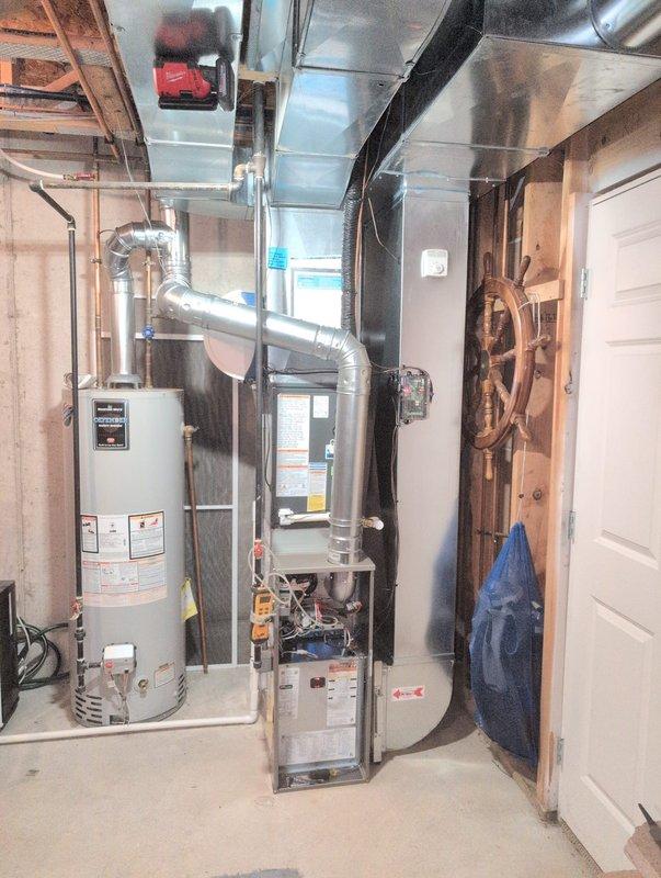 Installed a new gas furnace in the basement mechanical area, connecting it to the existing supply and return ductwork, humidifier, gas supply, and venting. Completed electrical and control connections, mounted the thermostat, and installed a new air filter. Verified proper system operation and left the work area clean.