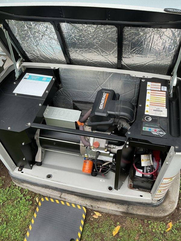 Performed scheduled annual maintenance on an 11-year-old Generac standby generator with an OHVI engine, including inspection of the enclosure, engine compartment, battery, and control panel. Replaced the Generac Genuine Parts oil filter and serviced the engine oil, noting the service date on the filter. All components were found clean with no evidence of leaks, rust, frost, or damage, and the unit was left in proper standby condition.