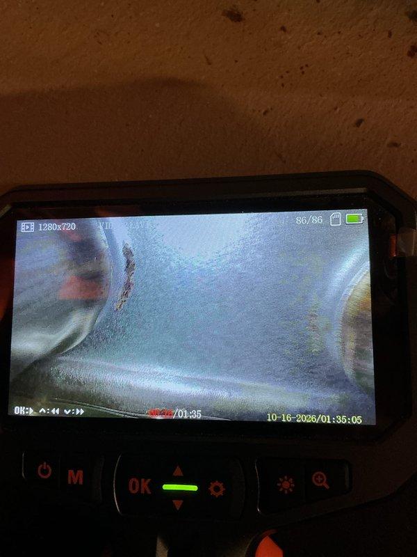 Performed annual heating inspection and maintenance on a 14-year-old Energi Air gas furnace, including visual inspection of the heat exchanger and internal ductwork using a digital inspection camera. Camera imagery showed light surface rust and condensation or frost in the interior, while the furnace, venting, and adjacent water heater exhibited no leaks or visible damage. System operation was verified, with no humidifier present.