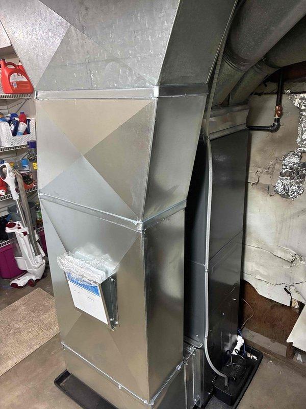 Installed a new gas furnace with matching evaporator coil and AC system, including fabricated galvanized plenum and supply/return duct transitions, flexible duct connections, and refrigerant line set connections. Routed and primed PVC combustion venting and condensate drain piping with a drain pan, connected the black iron gas line with shutoff valve, and completed equipment labeling. Secured Michigan Saves financing and initiated loan documentation.
