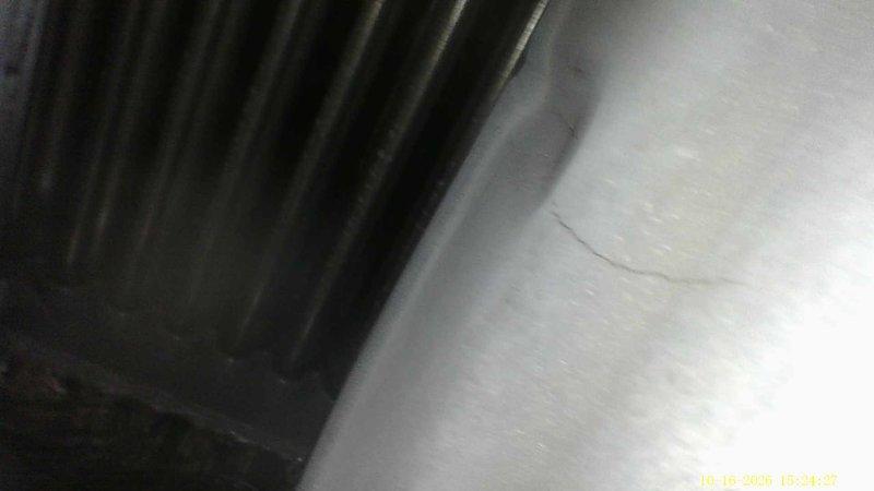 Responded to a no-heat call on a 24-year-old Payne furnace that failed to start following a prior service visit. Borescope inspection of the heat exchanger revealed hairline cracks and localized buckling in the metal, along with carbon and debris buildup at the base of the tubes. The cracked heat exchanger is a safety hazard (potential flue gas and carbon monoxide leakage), so the unit was deemed unsafe to operate and left off pending heat exchanger or furnace replacement.