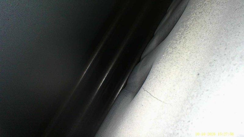 Responded to a no-heat call on a 24-year-old Payne furnace that failed to start following a prior service visit. Borescope inspection of the heat exchanger revealed hairline cracks and localized buckling in the metal, along with carbon and debris buildup at the base of the tubes. The cracked heat exchanger is a safety hazard (potential flue gas and carbon monoxide leakage), so the unit was deemed unsafe to operate and left off pending heat exchanger or furnace replacement.