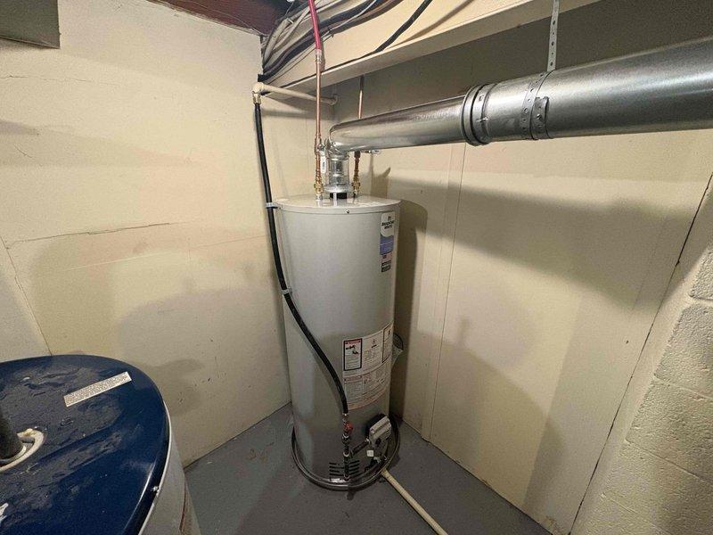 Removed and replaced the existing 50-gallon natural gas atmospheric-vent water heater, reconnecting the gas supply, copper water lines, pressure relief valve, and exhaust venting to the existing flue. Installed a water softener, tied into the water supply and drain, and verified proper operation, leak-free connections, and safe venting.