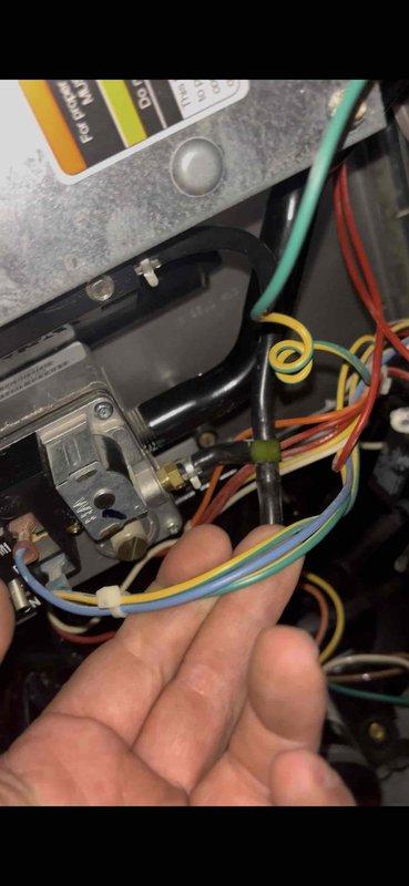 Responded to a no-heat call on a Bryant gas furnace (approx. 10 years old) and inspected the unit's internal wiring harness and gas valve assembly. Found loosely routed, cluttered low-voltage wiring in the control compartment; bundled and secured the wires with zip ties to restore proper routing and prevent interference with the gas valve and surrounding components. Verified no visible rust, frost, or physical damage to the cabinet interior.