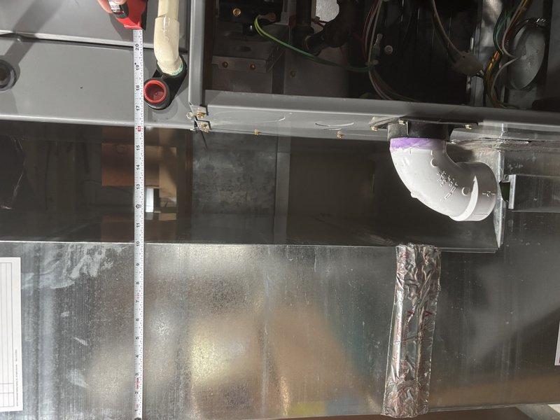 Responded to a no-heat call and inspected the furnace/air handler cabinet, including condensate drain piping, wiring, and supply ductwork. Verified supply plenum temperature of approximately 141°F using a digital thermometer, confirming the unit was producing heat, and checked plenum seams and foil-tape connections for leaks or deterioration with none found. Unit was operating within normal temperature range upon completion.