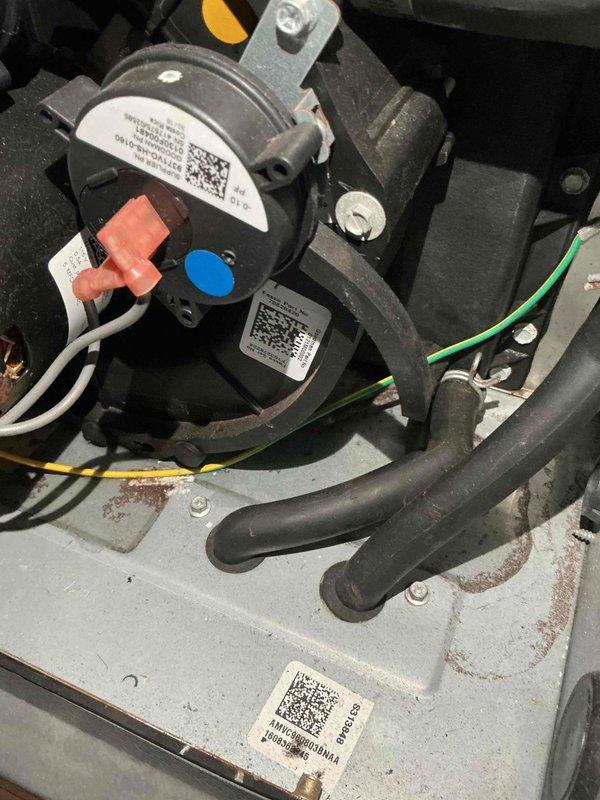 Performed annual heating tune-up on a 9-year-old furnace with humidifier service, including a borescope inspection of the internal heat exchanger and cabinet areas. Observed rust staining and corrosion residue on the cabinet floor near the pressure switch, inducer housing, and drain hoses, as well as on interior metal surfaces, indicating possible moisture or condensate intrusion; recommend monitoring and further evaluation of drain and hose connections.