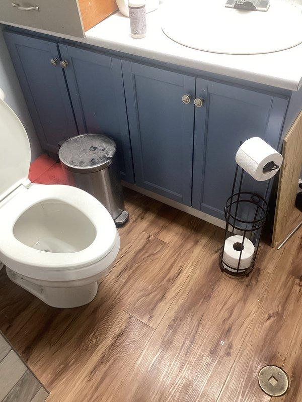 Responded to a recurring main drain backup, accessing the system through the bathroom floor cleanout and the laundry area drain connections. Inspected the washing machine standpipe and drain hose connections and the bathroom fixtures for signs of overflow and residue, then cleared the blockage in the main drain line to restore proper flow. Verified normal drainage from the fixtures and washer discharge following the clearing.