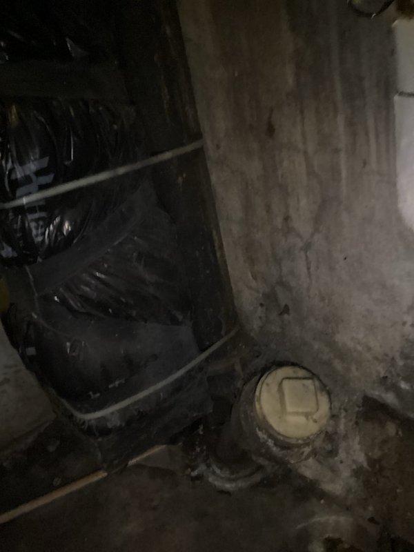Evaluated the basement for installation of a drain serving a customer-supplied utility sink and washer, with no existing plumbing at the proposed location. Inspected the existing sewer stack and cleanout, noting heavy soiling and moisture at the slab, and assessed routing for a new drain connection to the stack. Documented site conditions and field measurements to prepare the estimate for the proposed drain installation.