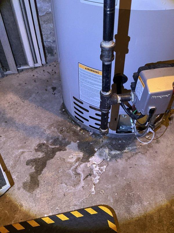 Performed annual heating tune-up on the 12-year-old Carrier furnace (no humidifier installed), including inspection of the burner compartment, access panel, and insulation, and verified safe operation. Noted staining and white mineral deposits on the concrete beneath the adjacent gas water heater, indicating possible past or active leakage, and recommend further evaluation of the water heater.