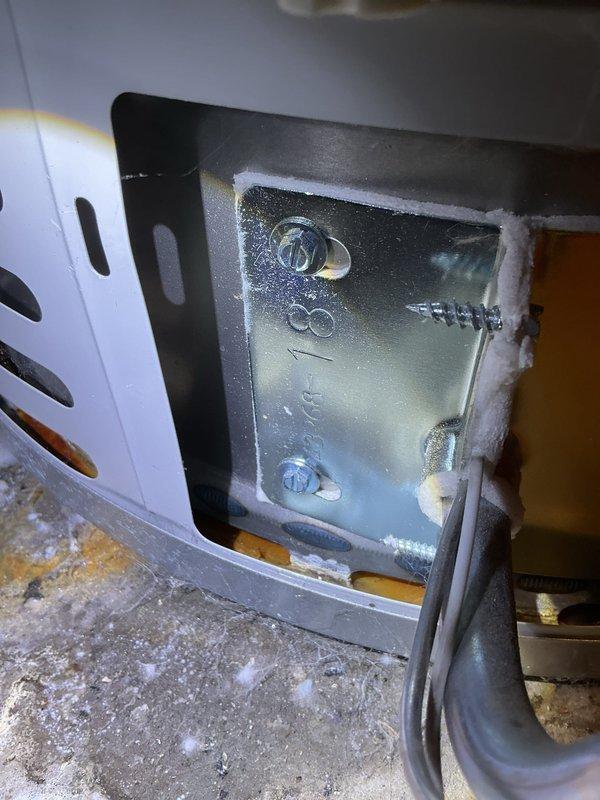 Performed annual heating tune-up on the 12-year-old Carrier furnace (no humidifier installed), including inspection of the burner compartment, access panel, and insulation, and verified safe operation. Noted staining and white mineral deposits on the concrete beneath the adjacent gas water heater, indicating possible past or active leakage, and recommend further evaluation of the water heater.