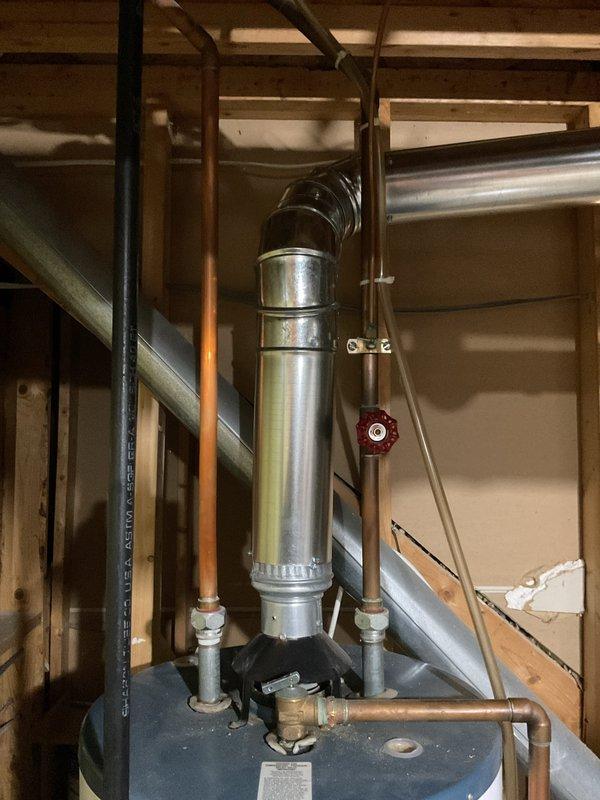 Responded to a reported water leak at an EnergiAir furnace and inspected the furnace and surrounding mechanical area, including the adjacent gas-fired water heater, its vent connector, and the supply piping and shutoff valve. Photo documentation of the mechanical space was taken, and no active leak source was documented at the time of inspection. Further diagnostics, such as checking the furnace condensate drain, trap, and secondary drain pan, are recommended if the leak recurs.