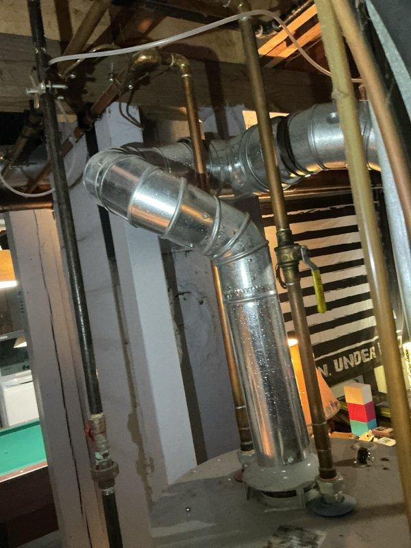 Inspected the furnace and surrounding ductwork, flue venting, and condensate and water lines in response to water leaking only during heating operation. Evaluated the galvanized flue and duct connections for condensation and moisture staining, and documented the findings with photos. Verified that heating operation remained functional and identified the likely moisture source for further corrective action.