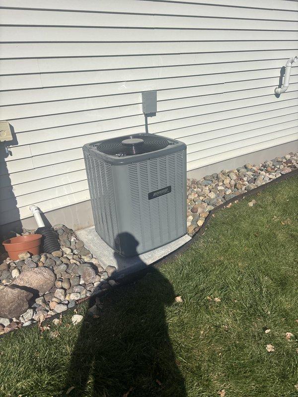 Replaced the existing air conditioning system with a new split-system AC, including the outdoor condenser set on the existing concrete pad and a new evaporator coil matched to the basement gas furnace. Connected the refrigerant lineset, condensate drain, and electrical disconnect, then evacuated and charged the system and verified proper operation and cooling performance.
