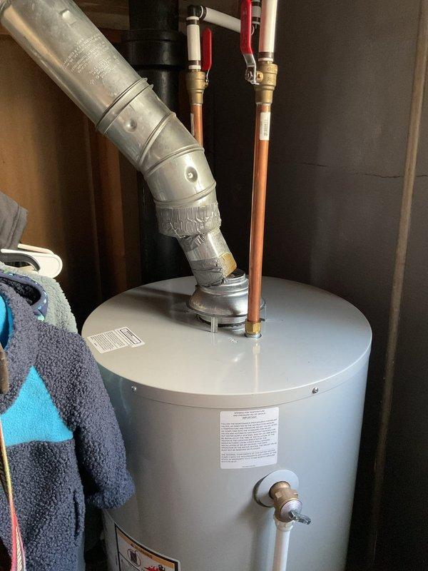 Inspected the 16-year-old furnace for a loud, labored operating noise and evaluated the blower assembly, motor, and supply ductwork for signs of excessive airflow restriction or mechanical wear. Checked the adjacent ductwork and venting, including the water heater flue connection, for secure fittings and proper airflow, and advised on the findings and recommended corrective action to restore quiet, efficient furnace operation.