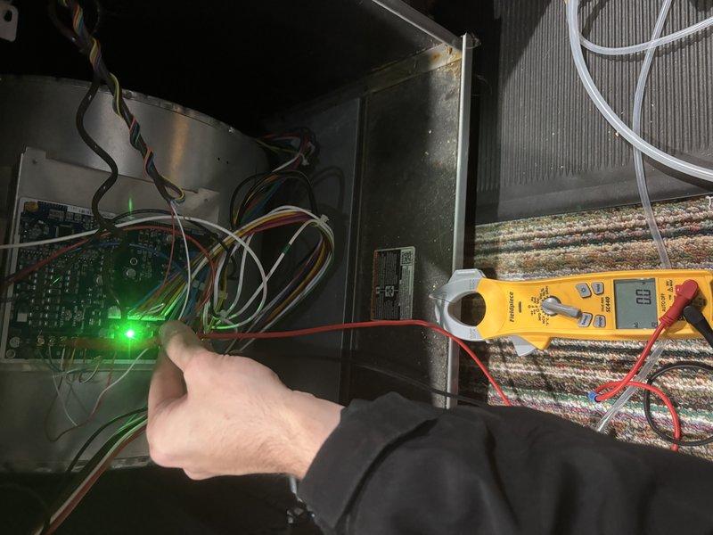 Performed the quoted filter housing modification on the air handler and verified system operation by checking the control board status indicator, low-voltage connections, and electrical readings with a clamp meter. Inspected the thermostat backplate wiring and terminal connections, confirming secure low-voltage conductors at the control terminals, with no visible damage, frost, or corrosion at the unit.