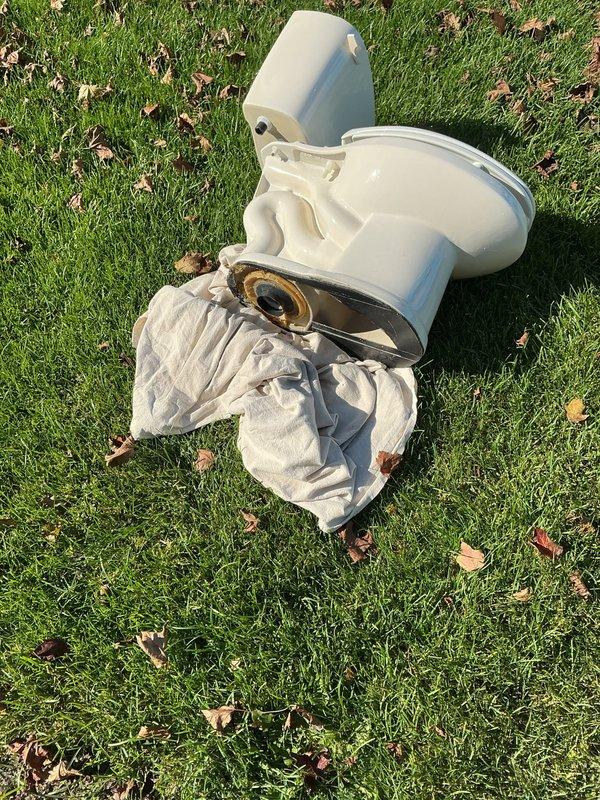 Responded to a follow-up complaint of a leaking toilet and a kitchen faucet sprayer that would not shut off. Pulled the toilet, removed the failed wax seal residue from the drain outlet, and reset the toilet on a new seal over the newly installed vinyl plank flooring. Secured the base and checked the supply line and valve connections for leaks. Kitchen faucet and sprayer replacement was requested but not confirmed in the photos, so warranty review and replacement status should be verified separately.