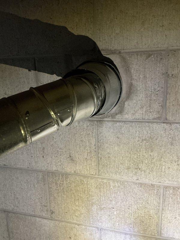 Performed an on-site estimate for furnace replacement following a prior diagnosis of a failed inducer motor. Inspected the existing high-efficiency condensing furnace, condensate pump and PVC drain line, refrigerant line set, and galvanized vent/flue penetration through the masonry wall, and documented equipment condition and installation conditions with photos to support replacement options.