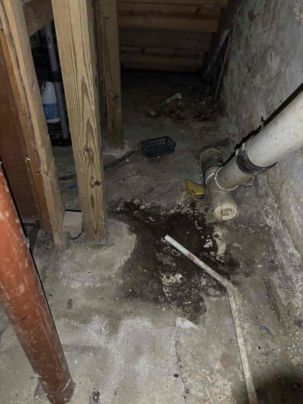 Corrected the furnace condensate discharge to comply with plumbing code by extending the condensate drain line with PVC piping and fittings to terminate at the existing trapped floor drain, eliminating the previous discharge onto the low-spot floor area. Verified the line is properly supported and pitched to drain, ensuring condensate now discharges to an approved location.