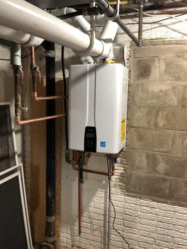 Responded to a no-heat call on a Lennox gas furnace approximately 7 years old and inspected the system, including the Honeywell Home digital thermostat, which displayed an indoor temperature of 62°F against a 70°F setpoint with a "Heat On" call active, confirming the thermostat was signaling for heat while the furnace failed to respond. Performed diagnostic evaluation of the heating equipment, and documented the installation with photos, including the adjacent tankless water heater, venting, and supply piping, with no visible frost, ice, or rust noted.