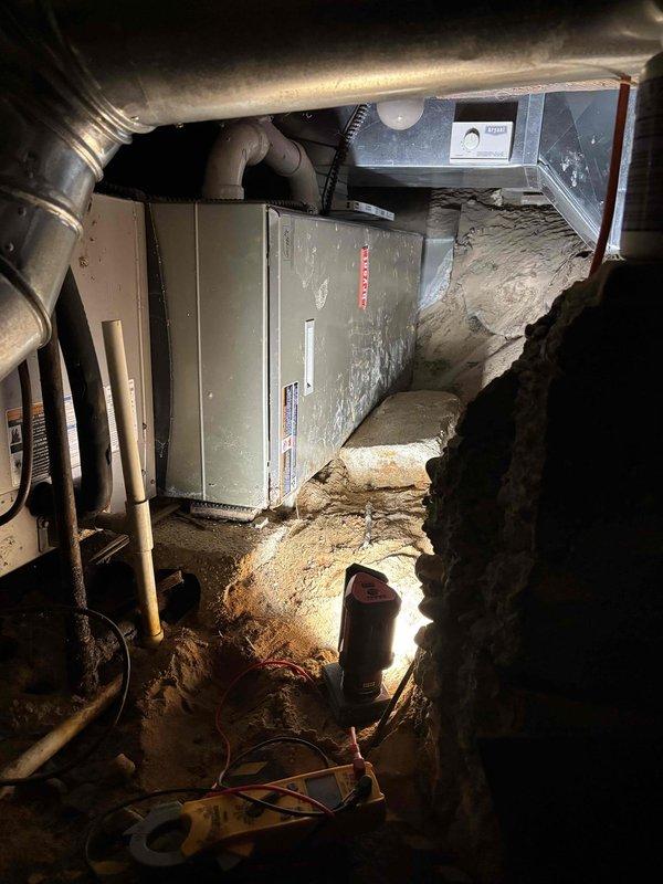 Performed annual heating tune-up on a 15-year-old Bryant furnace located in the crawl space, including inspection of the air handler, ductwork, and electrical connections with clamp meter testing of system operation. Inspected the Bryant humidifier and its PVC drain line, and replaced the air filter per client request. Verified proper thermostat control and heating performance.