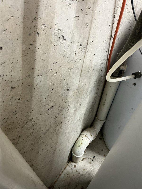 Inspected the non-cycling water softener and found the brine tank holding cloudy standing water, indicating a brine system or regeneration fault, and serviced the unit to restore cycling. Also evaluated the burst feeder line to the exterior spigot, which was accessible and exposed, and addressed the pipe for repair or replacement.