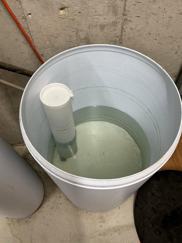 Inspected the non-cycling water softener and found the brine tank holding cloudy standing water, indicating a brine system or regeneration fault, and serviced the unit to restore cycling. Also evaluated the burst feeder line to the exterior spigot, which was accessible and exposed, and addressed the pipe for repair or replacement.